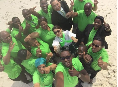 green world members at beach